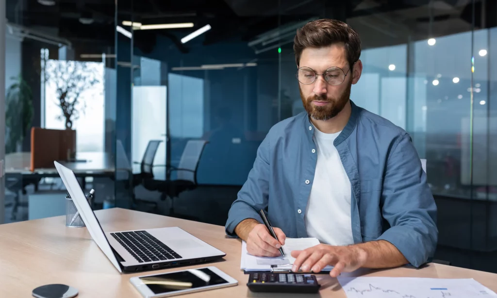 Thrive in Financial Services a male financial adviser looking for the most beneficial investment for his client