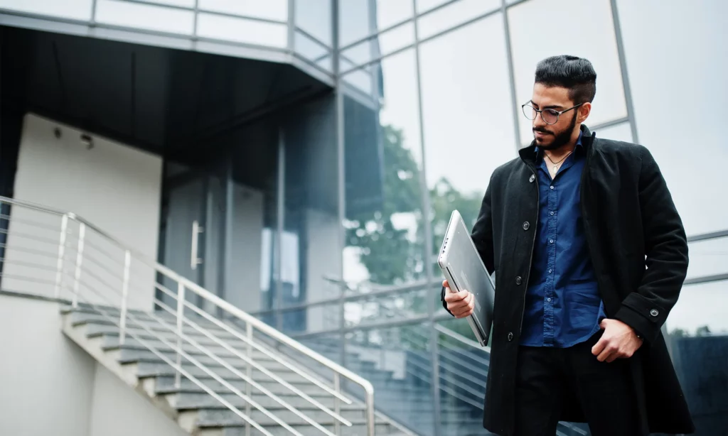 Different Types of Phishing Techniques a male cybersecurity engineer holding a laptop