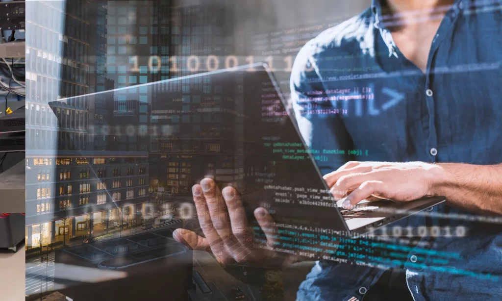 Different Types of Phishing Techniques a male hacker creating a phishing code on his laptop