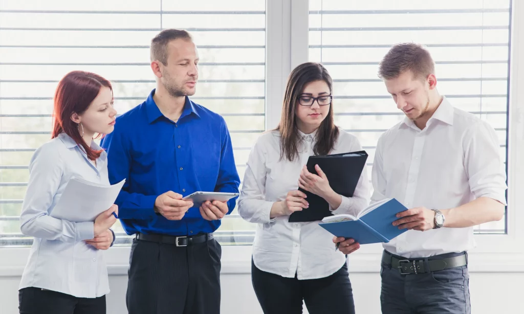 Thrive in Financial Services a team of paraplanners having a discussion with the financial adviser about a client's investment