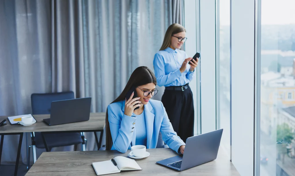 outsource social media management two female social media management specialist confirming their progress to the client