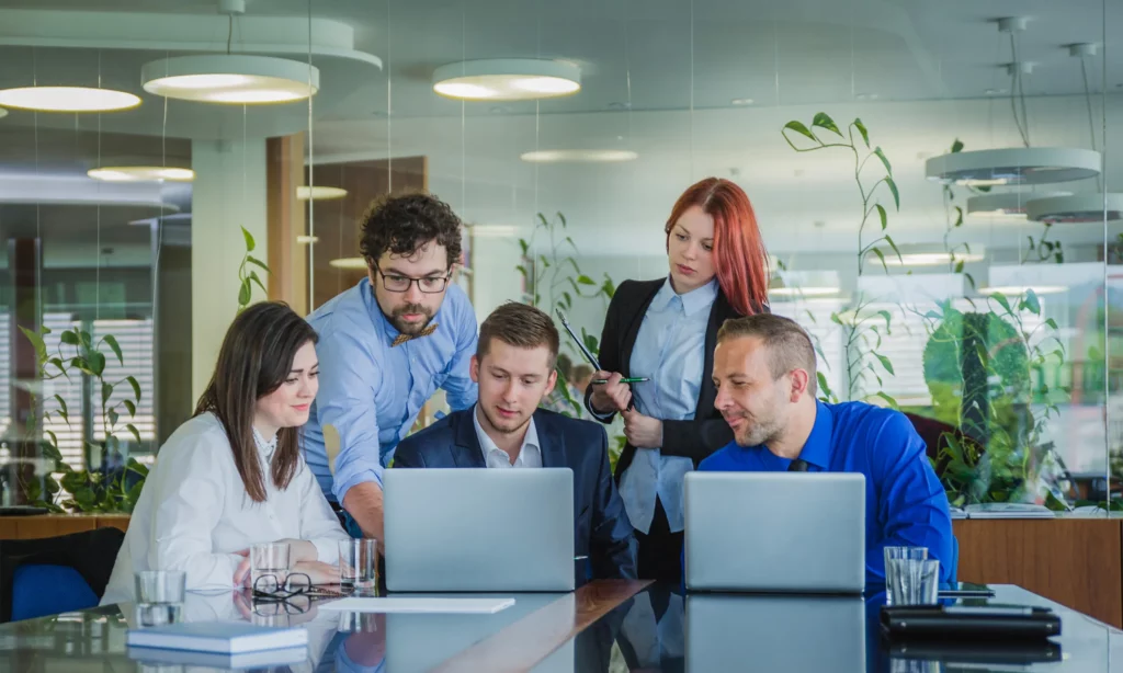 outsource social media management a team of social media management specialist brainstorming for their next campaign