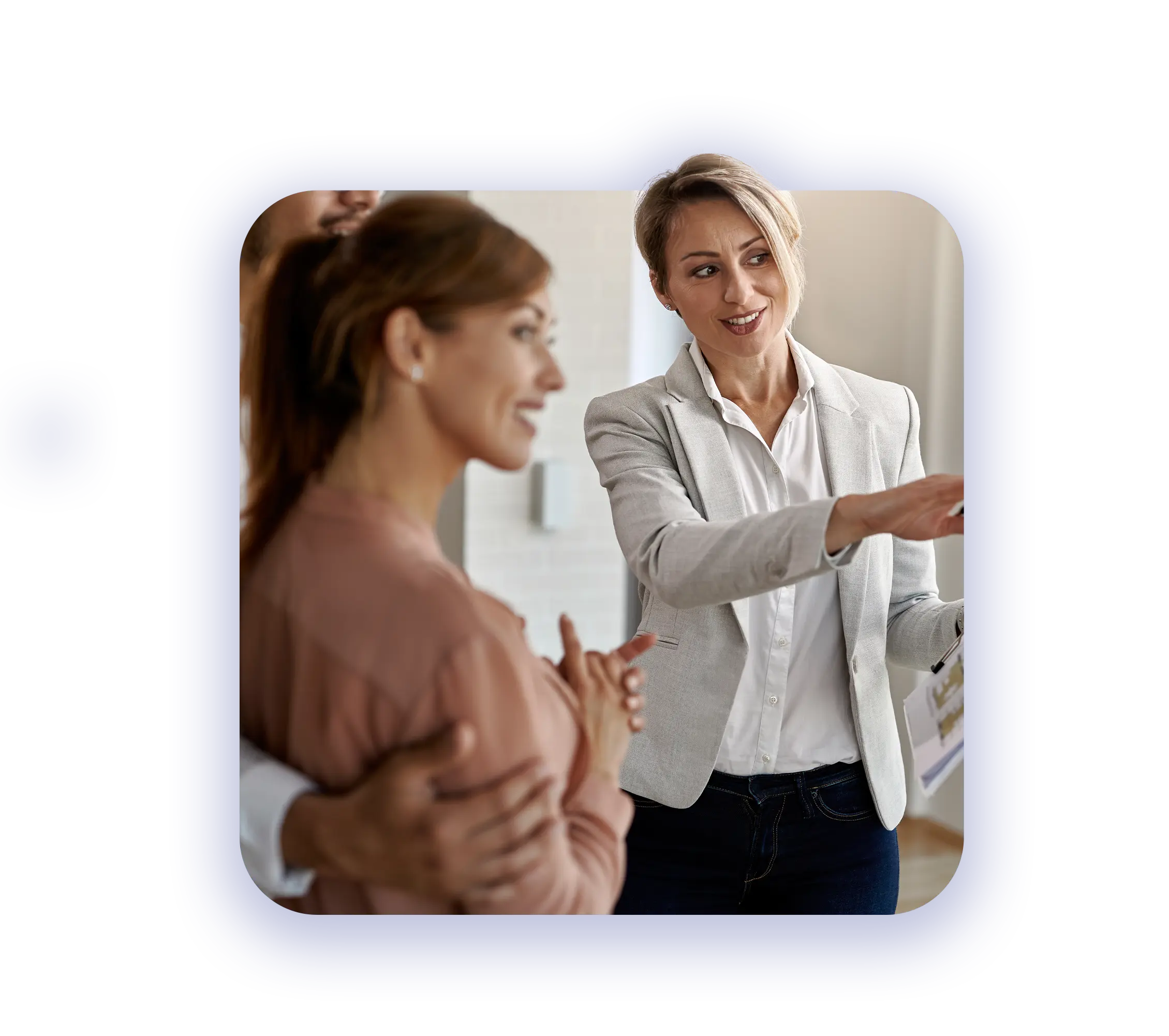 Streamlined Mortgage Support Solutions - female reals estate agent showing a house to possible buyers