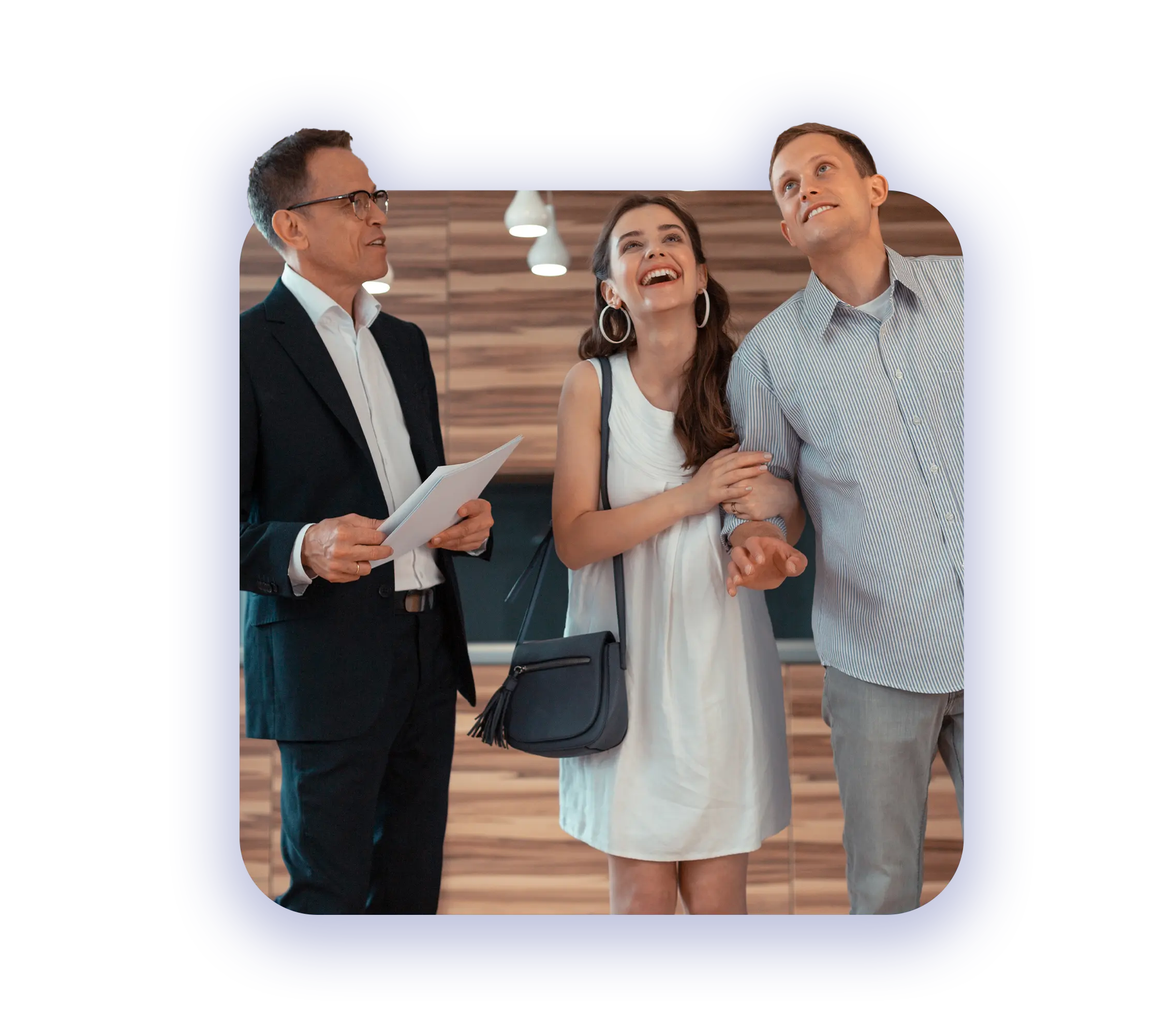 Streamlined Mortgage Support Solutions - male reals estate agent showing a house to a very excited couple