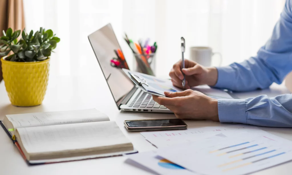 Thrive in Financial Services a closeup of a male financial adviser doing research for his client's portfolio