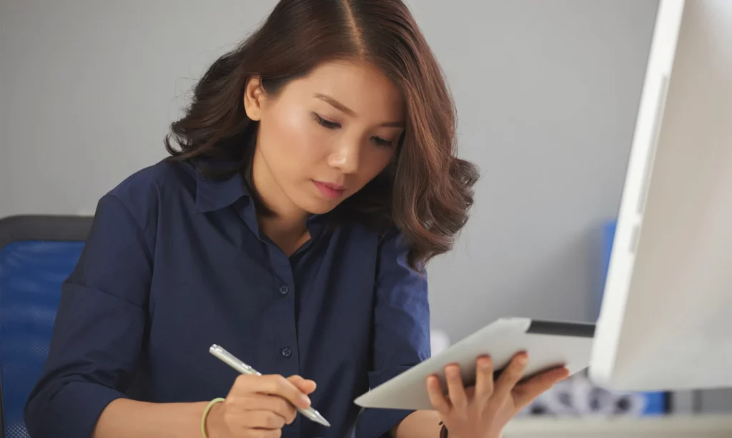 premium back office outsourcing services a business woman trying to reconcile her financial transactions